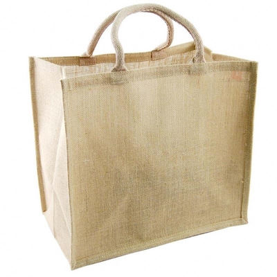 Las mujeres varan medio manejaron el bolso de compras del yute de los 50cm